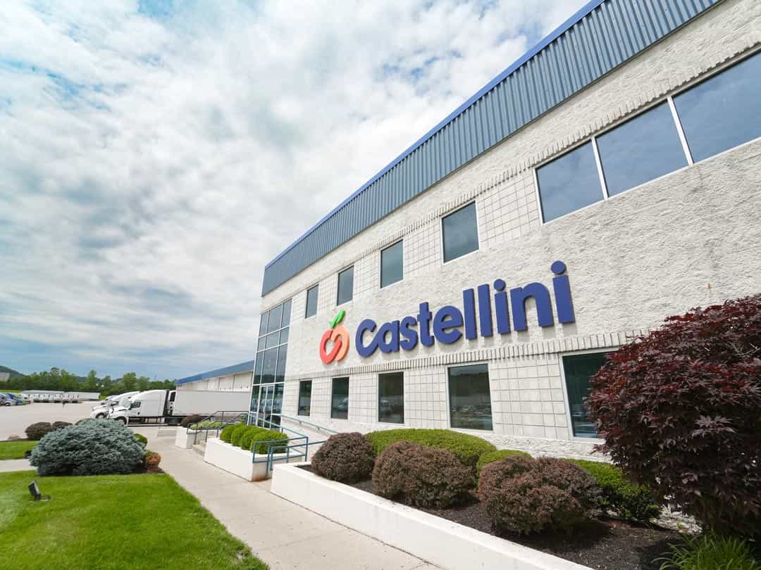 Castellini Company building with trucks at loading docks in background