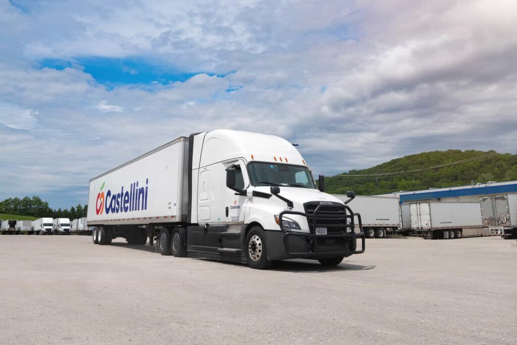 Castellini Company LTL distribution tractor trailer truck with cold storage parked in a loading dock